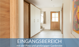 A bright entrance area with plenty of space and a generous wardrobe. The room feels modern and inviting.
