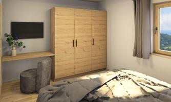 A modern bedroom with wooden cabinets and a desk. A window offers a view of nature, while a comfortable bed is in the foreground.