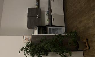 A modern kitchen with light-colored cabinets and a refrigerator. A green tree stands in the corner.