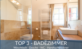 A modern bathroom with an open shower, a sink, and a towel warmer. Bright colors and plenty of daylight create an inviting atmosphere.
