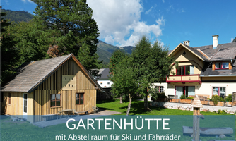 A garden shed with storage space for skis and bicycles. Surrounded by a green meadow and trees.