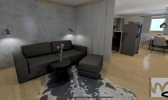 A modern living room with a gray sofa and a small table. The room has a warm wooden floor and a cozy atmosphere.