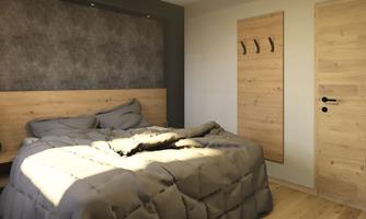 A modern bedroom with a large bed and a wooden headboard. The walls are kept neutral, and there is a wooden coat hook as well as a door in the background.