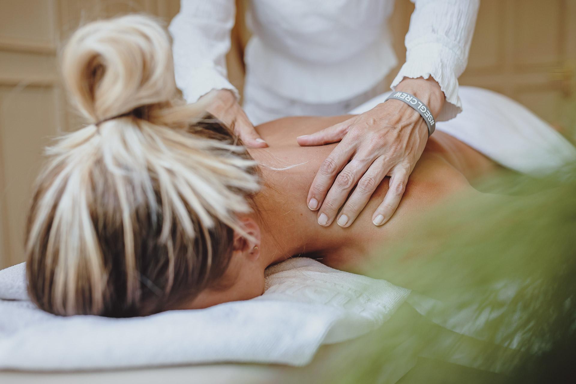 A relaxing massage is being performed on a woman. The atmosphere is calm and soothing.