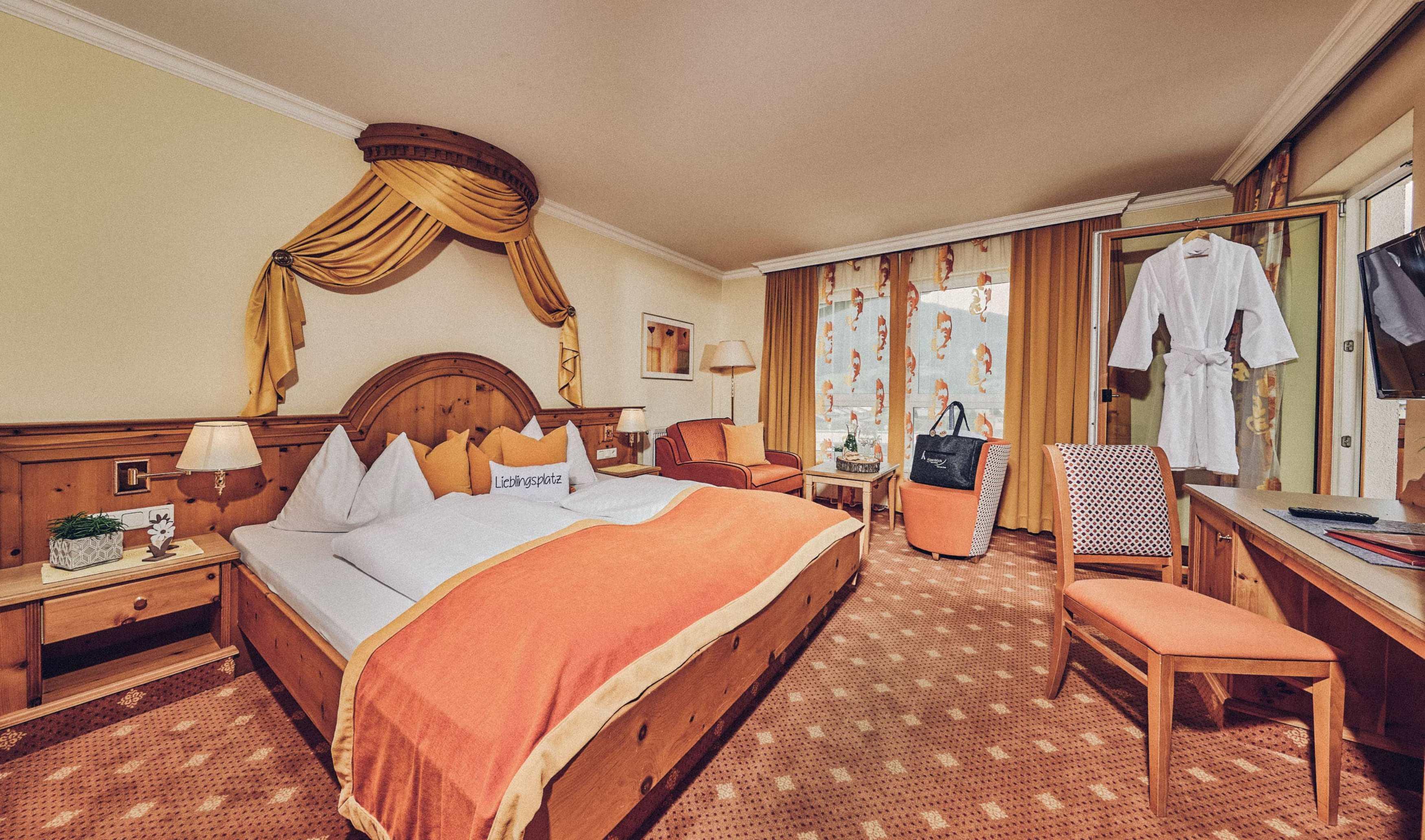 A cozy hotel room with a large bed and warm colors. The windows offer a view of a stylish decor and a relaxing atmosphere room.