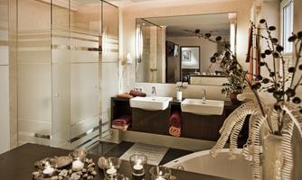 An elegant bathroom with modern double sinks and a large shower. Soft lighting and decorative elements create a relaxing atmosphere.