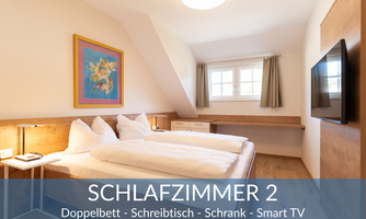 Bright bedroom with a double bed, desk, and smart TV. Large windows provide plenty of daylight.