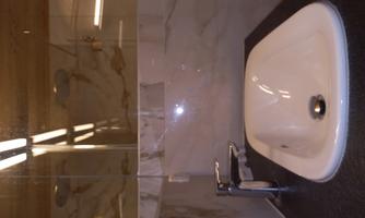 A modern sink in a stylish bathroom. The room is equipped with light walls and elegant lighting.