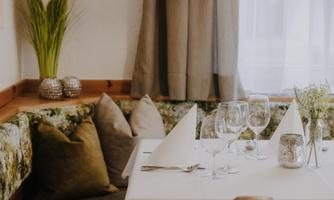 An inviting dining area with a beautifully set table.