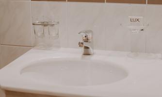 A modern sink with a shiny faucet.