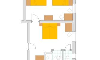 A floor plan drawing of an apartment with two bedrooms, a bathroom, and a central living area. The furniture is schematically represented in yellow color.