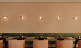 A stylish restaurant with modern furniture. The soft lighting creates an elegant atmosphere.