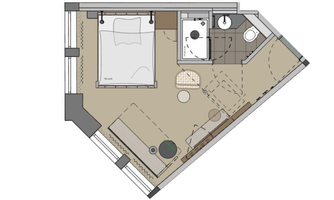 A floor plan drawing of a room with a bed, a bathroom, and a small seating area. The space has a modern layout and is brightly designed.