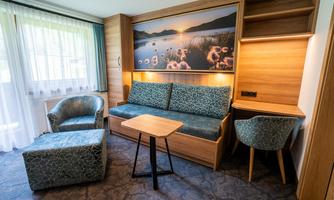 Our newly renovated family room is furnished with a lot of love and passion.  
With the cozy couch and the great lounge chairs, it offers a wonderful place to end the day comfortably.