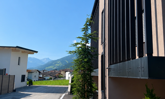 The view behind the entire building facing south. The vacation apartment is located in the rear area.