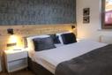 Schlafzimmer 2 mit Kachelofen Schlafzimmer 2 mit Kachelofen
