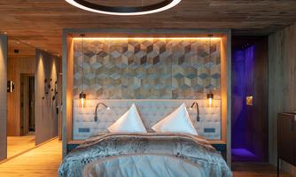 A modern bedroom with a stylish geometric wall design. Soft lighting creates a cozy atmosphere.